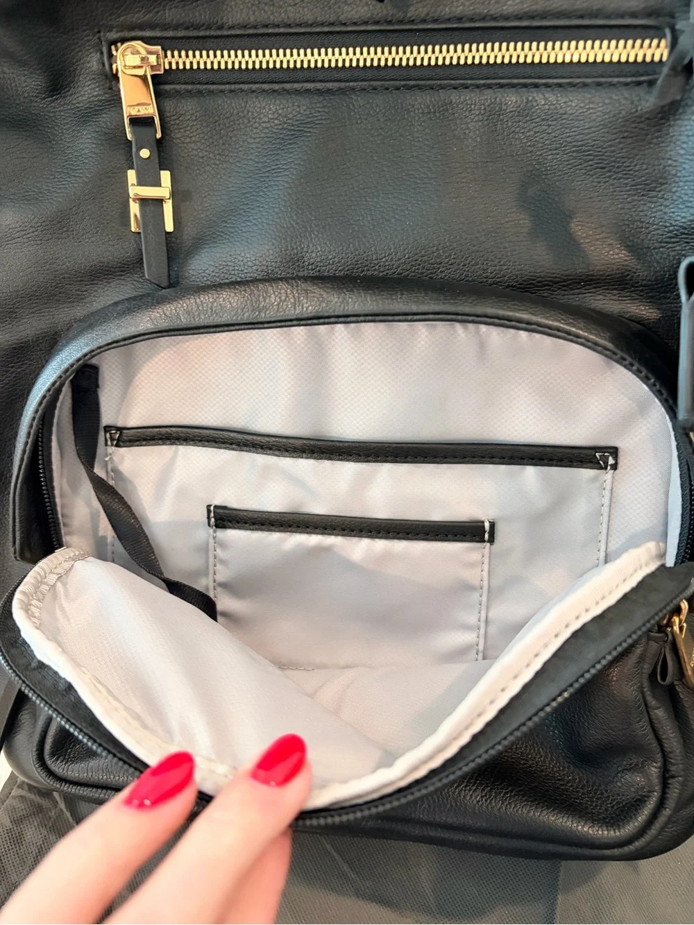 Tumi Black Leather Backpack with Gold Hardware